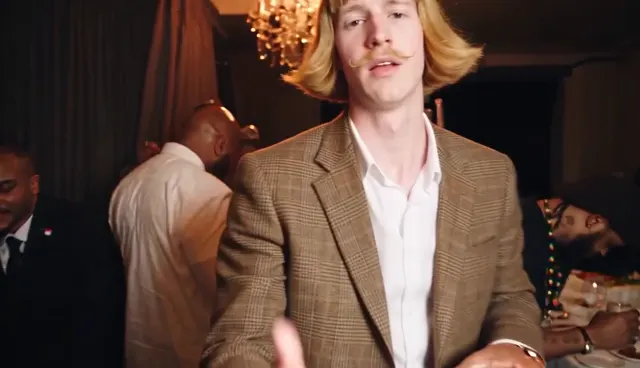 Burning Bridges AI video close-up: the lead flicks a hand at the camera and mouths the lyric